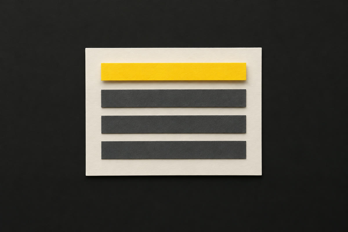 Illustration of an off-white paper listing card with four stacked paper strips, the top one yellow, on charcoal.